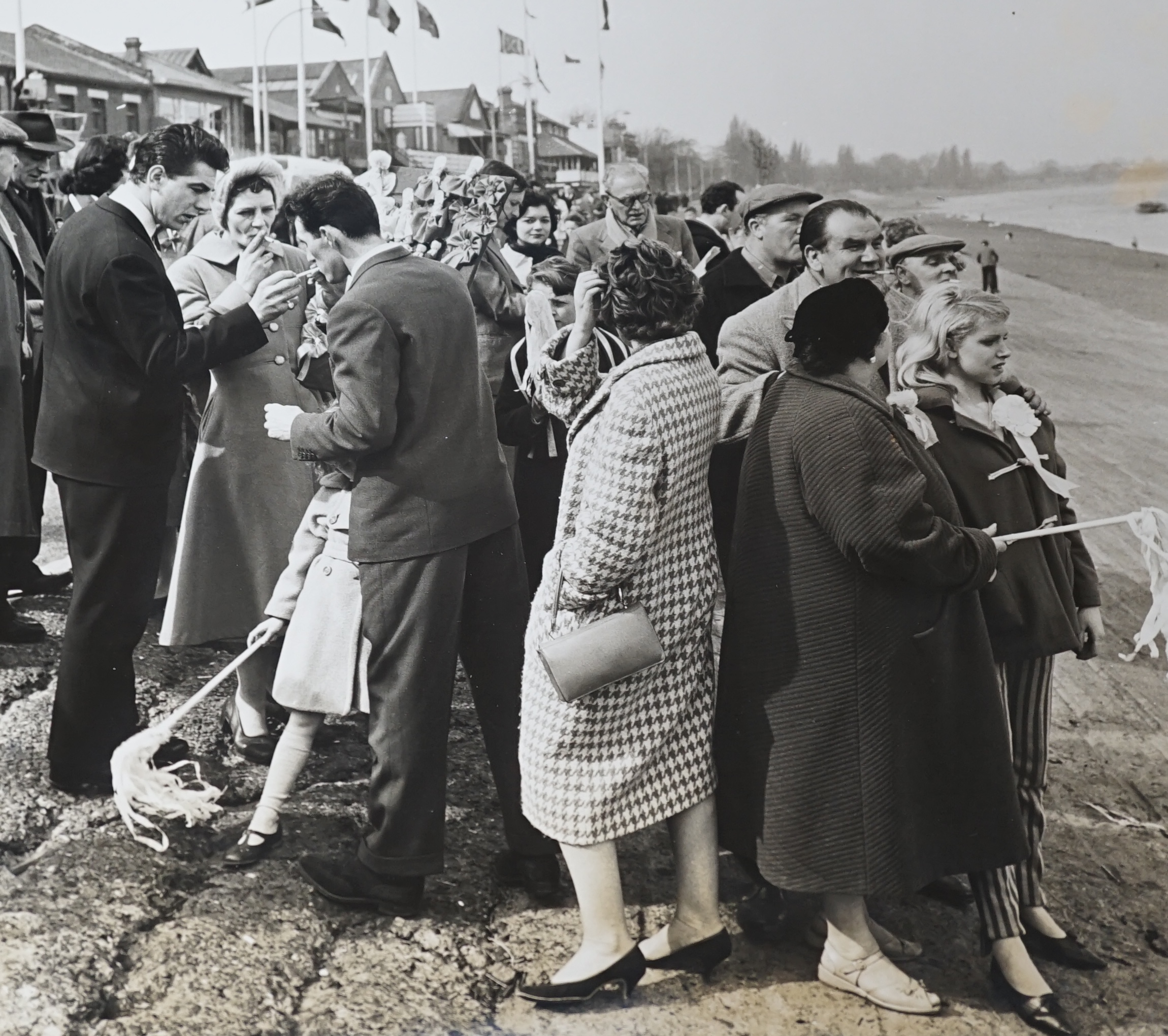 Bert Hardy, two black and white photographs, Coastal views with figures, one stamped verso, largest 28 x 34cm, unframed. Condition - fair to good
